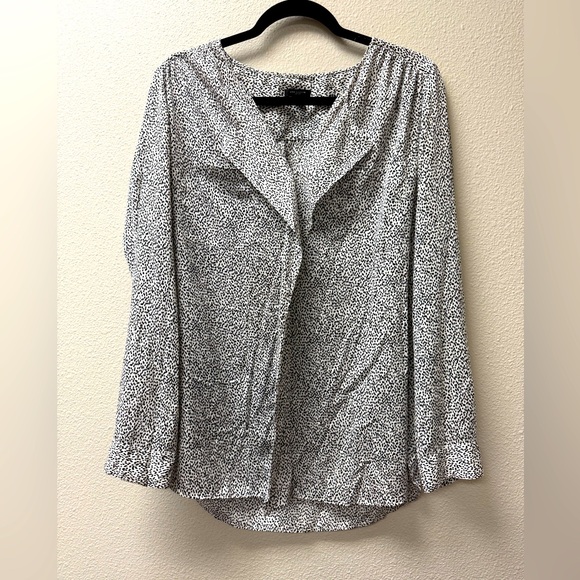 Ann Taylor Tops - Ann Taylor long sleeved blouse. Black and white. Size 10 with stylish ruffles.